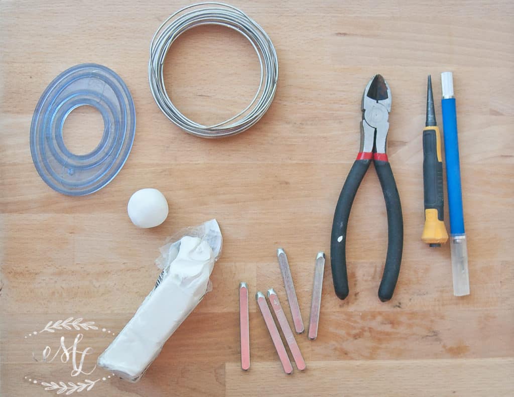 tools laid out that are used to make plant markers in this DIY tutorial