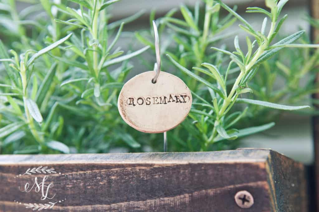 handmade antique looking plant marker reading "rosemary"