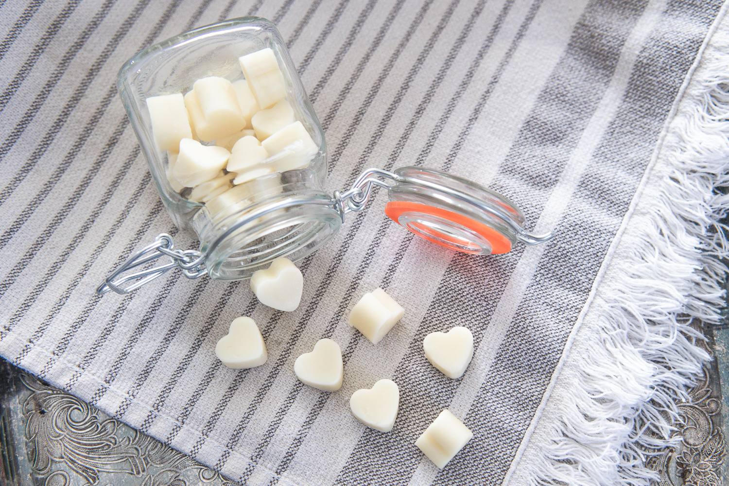 mini lotion bars pouring out of a container