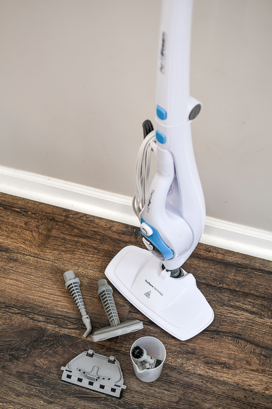 close up of a steam cleaner and all its attachments