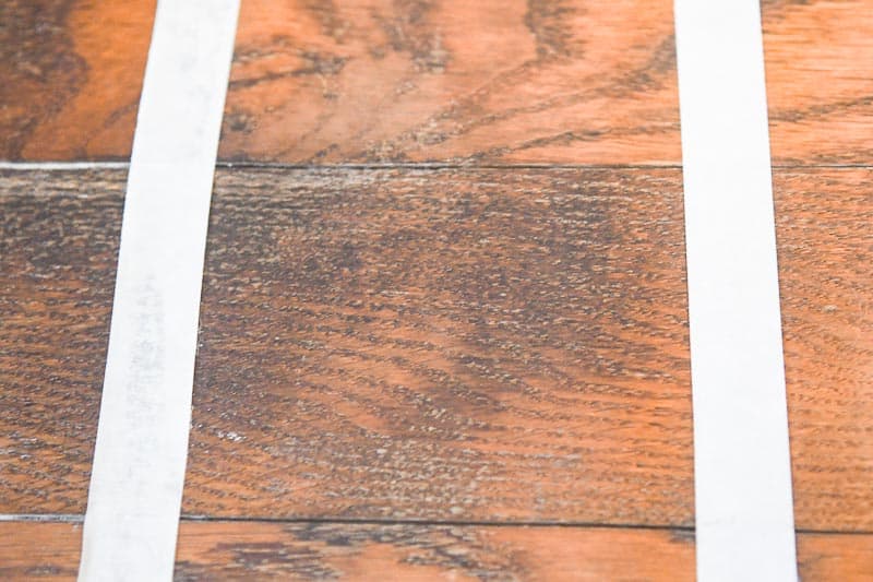 Dark wood stain treated with Nature's Miracle to remove stains from wood floors